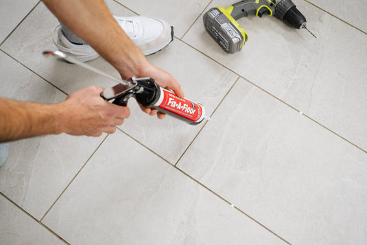 How to inject adhesive underneath tile floors. Repairing hollow flooring