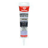 Red Devil flooring repair filler tube on a white background