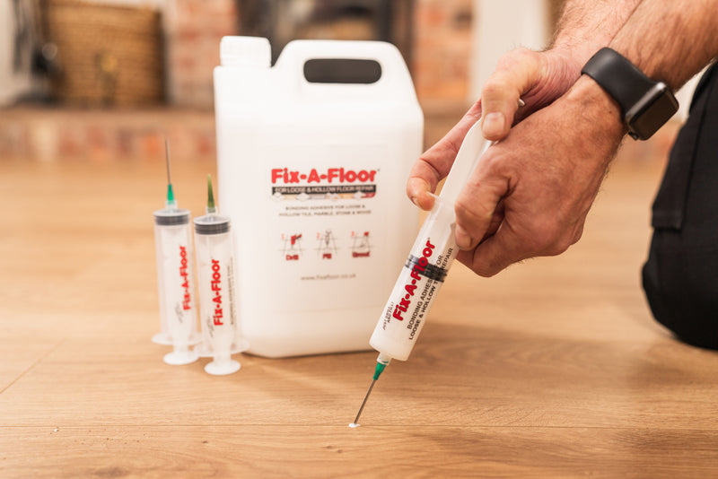 Load image into Gallery viewer, Fix-A-Floor 5 Litre Tub Kit with 6 Syringe applicators - Extra Strength Bonding Adhesive for Loose and Hollow Tiles
