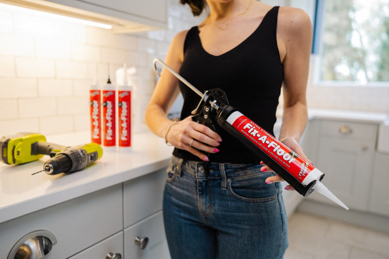 Load image into Gallery viewer, Women holding a Bonding Tube with a caulk gun
